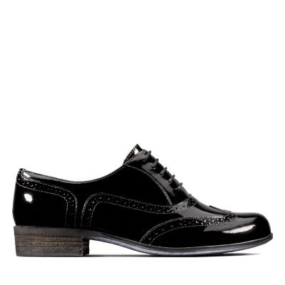 black patent brogue boots