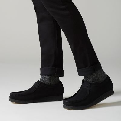 all black wallabees