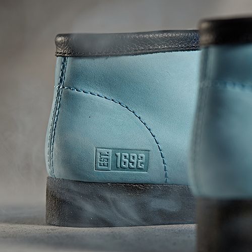 Close up of 'Est.1692' stamp on the light blue Raheem Sterling wallabee